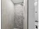 Stylish shower with grey subway tiles, chrome fixtures, and glass door at 1470 Serpentine S Dr, St Petersburg, FL 33705