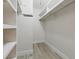 Organized walk-in closet with white shelves and ample storage space at 1470 Serpentine S Dr, St Petersburg, FL 33705