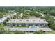 Sprawling condo community boasting a refreshing pool, lush greenery, and convenient carport parking at 1485 Lakeview Rd # 19, Clearwater, FL 33756