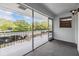 Screened-in balcony offers a view of the neighborhood street and parked vehicles at 1485 Lakeview Rd # 19, Clearwater, FL 33756
