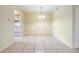Open dining room area with views into the kitchen with tile flooring at 1485 Lakeview Rd # 19, Clearwater, FL 33756