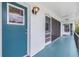 Exterior hallway featuring unit entrances with visible unit numbers and outdoor lighting at 1485 Lakeview Rd # 19, Clearwater, FL 33756