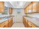 Functional kitchen featuring tile flooring, neutral counters and cabinets at 1485 Lakeview Rd # 19, Clearwater, FL 33756