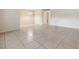 Bright living room area featuring tile flooring and a modern light fixture at 1485 Lakeview Rd # 19, Clearwater, FL 33756
