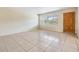 Inviting living room with natural light streaming through a window by the front door at 1485 Lakeview Rd # 19, Clearwater, FL 33756
