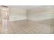 Open living room with tiled floors, new paint, and ample space at 1485 Lakeview Rd # 19, Clearwater, FL 33756