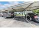 Designated covered parking area with vehicles, offering shade and protection at 1485 Lakeview Rd # 19, Clearwater, FL 33756