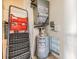 A utility room with a water heater, ladders, HVAC and other utility equipment at 1485 Lakeview Rd # 19, Clearwater, FL 33756