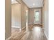Inviting foyer features wood-look floors and a glass front door at 16723 Blackwater Ter, Bradenton, FL 34202