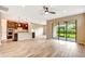 Spacious living room with tile floors, sliding glass doors to the backyard, and neutral paint at 16723 Blackwater Ter, Bradenton, FL 34202