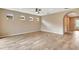 Empty living room area offering tile floors, neutral paint, and a ceiling fan at 16723 Blackwater Ter, Bradenton, FL 34202