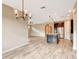 Open floor plan with kitchen island, stainless appliances, arched entry, recessed lighting, and tile floor at 16723 Blackwater Ter, Bradenton, FL 34202