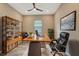 Well-lit office space features a spacious desk, comfortable seating, and ample storage with modern shelving at 16723 Blackwater Ter, Bradenton, FL 34202
