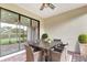 Covered patio with dining table, chairs, and view of the backyard at 16723 Blackwater Ter, Bradenton, FL 34202