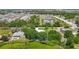 Expansive aerial view showcasing lush landscaping, community lakes, and beautiful homes in a desirable neighborhood at 1914 Henley Rd, Lutz, FL 33558