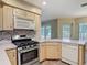 Functional kitchen with stainless steel appliances, sleek countertops, and neutral-toned cabinetry at 1914 Henley Rd, Lutz, FL 33558
