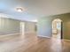 Open living room area featuring beautiful wood floors and an abundance of natural light at 1914 Henley Rd, Lutz, FL 33558