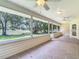 Picturesque view from a screened porch with tile flooring overlooking a lush backyard at 1914 Henley Rd, Lutz, FL 33558