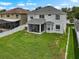 Expansive backyard featuring a screened porch, and a well-maintained lawn at 1933 Fruitridge St, Brandon, FL 33510