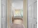 Bright bathroom featuring a tub under a window and a glass-enclosed shower at 1933 Fruitridge St, Brandon, FL 33510