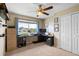 Bedroom featuring a ceiling fan, window, and white closets at 1933 Fruitridge St, Brandon, FL 33510