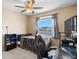 Bedroom featuring a ceiling fan, window, and black desk at 1933 Fruitridge St, Brandon, FL 33510