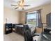 Bedroom featuring a ceiling fan, window, and black desk at 1933 Fruitridge St, Brandon, FL 33510