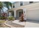 Welcoming entryway with covered porch and manicured landscaping at 1933 Fruitridge St, Brandon, FL 33510