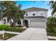 Attractive two-story home with a well-kept lawn, a paved driveway, and manicured landscaping at 1933 Fruitridge St, Brandon, FL 33510