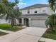 Two-story home with a well-maintained lawn, an attached two-car garage, and an inviting front entrance at 1933 Fruitridge St, Brandon, FL 33510