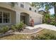 Charming home features a well-manicured lawn, neutral paint, and an attached two-car garage at 1933 Fruitridge St, Brandon, FL 33510