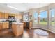 Bright kitchen with wooden cabinets, stainless steel appliances, and a view of the pond at 1933 Fruitridge St, Brandon, FL 33510