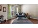Inviting living room boasts hardwood floors, a comfortable couch, and ample natural light at 1933 Fruitridge St, Brandon, FL 33510
