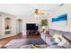 Spacious living room with hardwood floors, a large couch, and a ceiling fan at 1933 Fruitridge St, Brandon, FL 33510