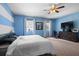 Large main bedroom with carpet floors, ceiling fan, and views to the outside at 1933 Fruitridge St, Brandon, FL 33510