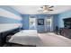 Spacious main bedroom with a ceiling fan, carpet floors, and natural light at 1933 Fruitridge St, Brandon, FL 33510