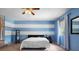 Comfortable main bedroom with carpet, blue walls, and lots of light at 1933 Fruitridge St, Brandon, FL 33510