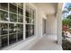 Exterior view of covered patio, tiled floor, and trimmed landscaping at 1933 Fruitridge St, Brandon, FL 33510
