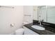 Bathroom featuring granite countertop, modern fixtures, and a glass-enclosed shower at 212 Shell Creek Ct, Apollo Beach, FL 33572