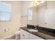 Bathroom featuring granite countertop, modern fixtures, vanity and tile flooring at 212 Shell Creek Ct, Apollo Beach, FL 33572