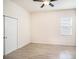 Bedroom features wood-look tile flooring, closet and a ceiling fan at 212 Shell Creek Ct, Apollo Beach, FL 33572