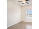 Simple bedroom with tile floor, ceiling fan, and a window with blinds at 212 Shell Creek Ct, Apollo Beach, FL 33572