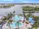 Overhead view of a stunning community pool, clubhouse, and recreational facilities by the lake at 212 Shell Creek Ct, Apollo Beach, FL 33572