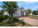Stylish single-Gathering home with a brick driveway and attached two-car garage at 212 Shell Creek Ct, Apollo Beach, FL 33572