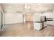 Open kitchen with stainless steel appliances, granite counters, and large island connecting living space at 212 Shell Creek Ct, Apollo Beach, FL 33572