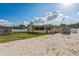 Spacious backyard featuring a screened porch, shed, and large gravel area at 2204 78Th W St, Bradenton, FL 34209