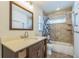 Bathroom offers a shower over the tub and a granite-look vanity at 2204 78Th W St, Bradenton, FL 34209