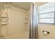 Bathroom featuring a shower over the tub with white tiling and shower curtain at 2204 78Th W St, Bradenton, FL 34209