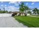 Spacious corner lot featuring a well-manicured lawn and a white vinyl fence at 2204 78Th W St, Bradenton, FL 34209