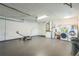 A tidy garage with laundry machines, water heater, and yard tools at 2204 78Th W St, Bradenton, FL 34209